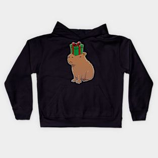 Capybara with a Christmas present on its head Kids Hoodie